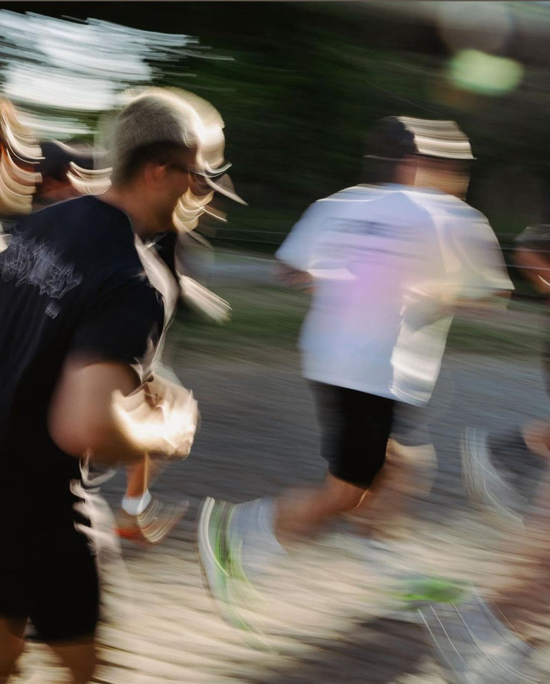 Blurred image of people running on a road