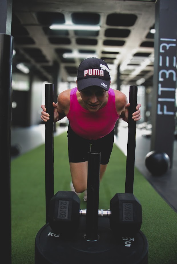 Fitberi member using sled push at the Hybrid zone